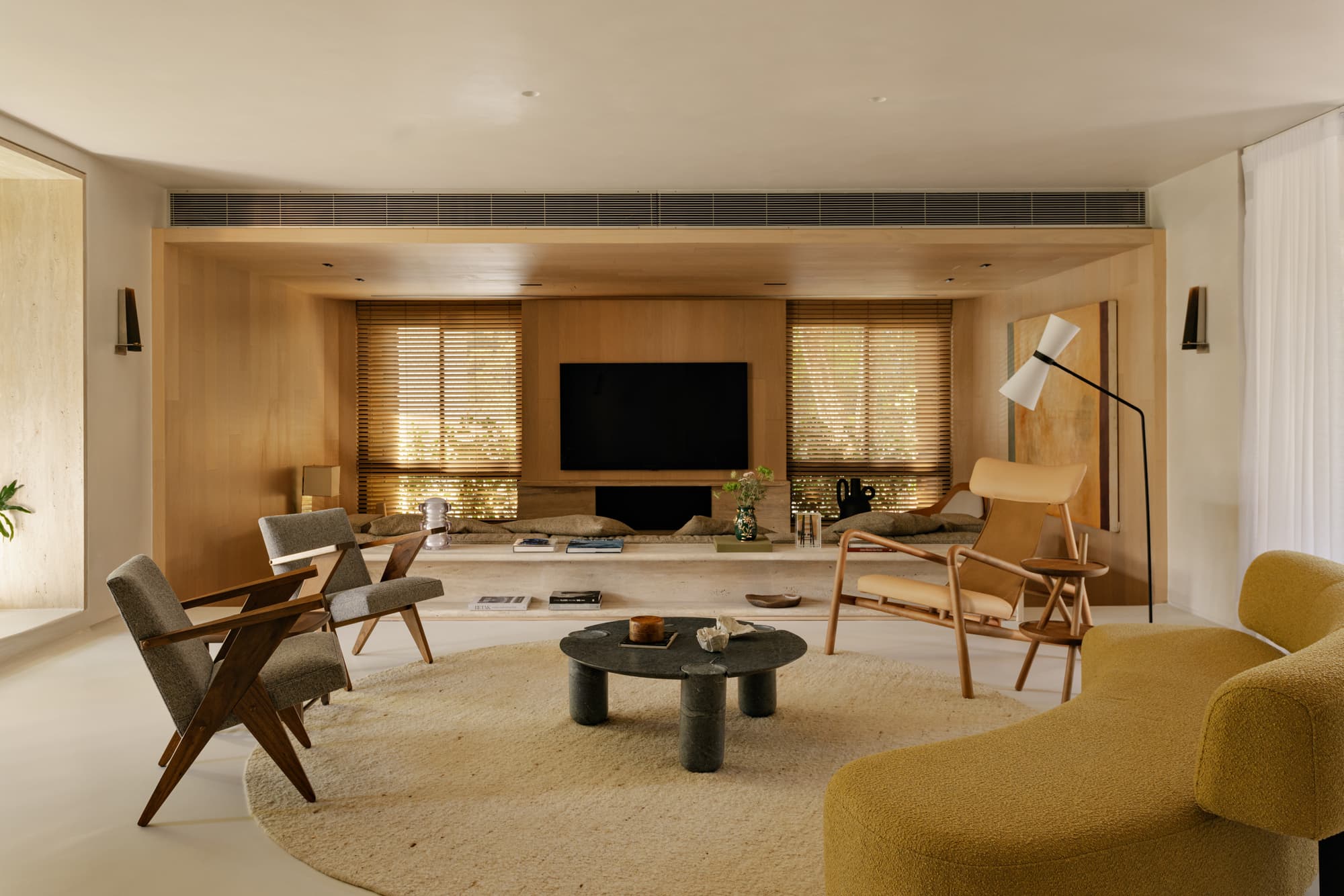 Warm minimal living room with soft daylight and oak furniture
