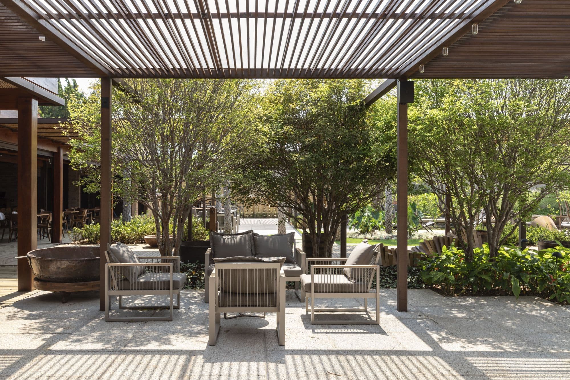 Tropical garden and pool terrace beside a modern villa